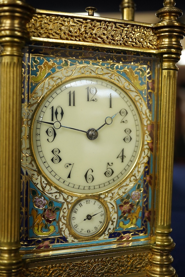 An early 20th century champleve enamel repeating carriage clock with subsidiary dial, with key, 19cm high